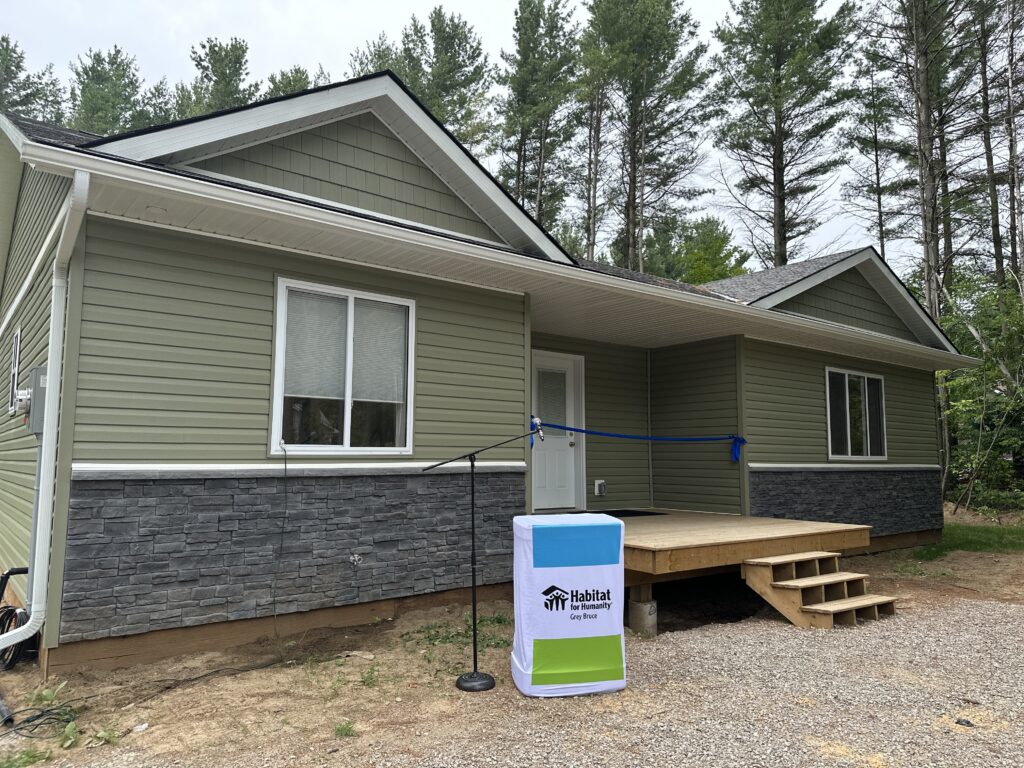 House with Green Siding at the Home Dedication at Saugeen First Nation