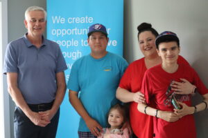 Greg, Executive Director, stands with Habitat family from Wiarton