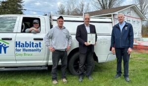 (left to right) Colin Hokea, (Electrical Apprentice), Mike Frail, (Master Electrician), MPP Rick Byers, Bruce Grey Owen Sound and Greg Fryer, Executive Director Habitat for Humanity Grey Bruce)